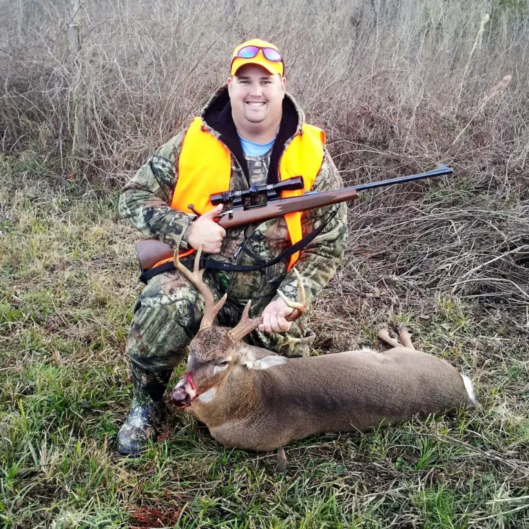 Man with gun shot deer