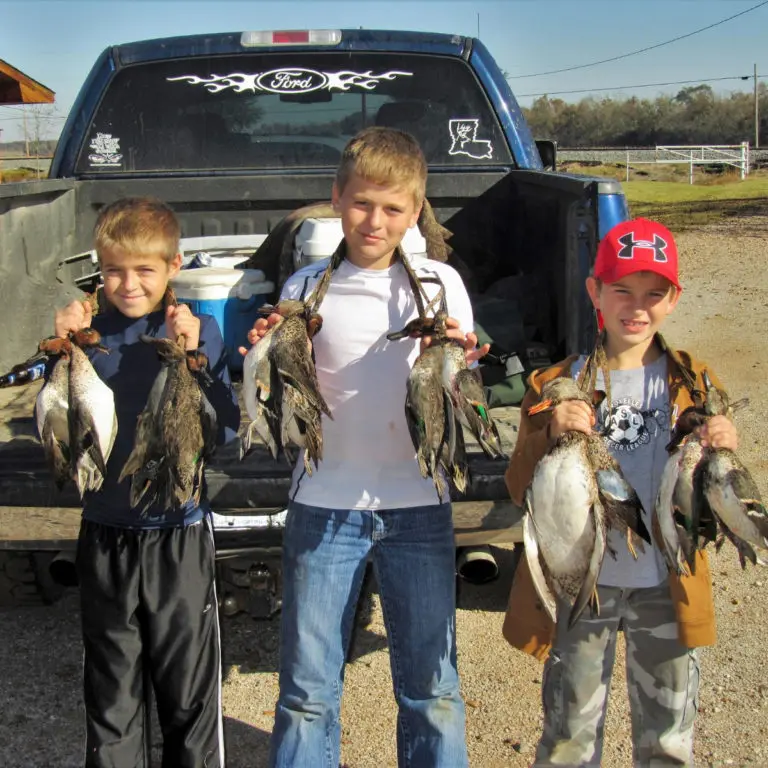 Kids with hunted ducks