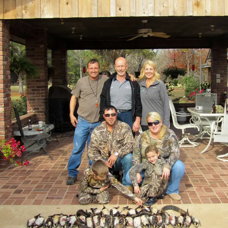 Family of hunters with ducks